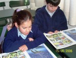 Valentina and Leandro reading together.